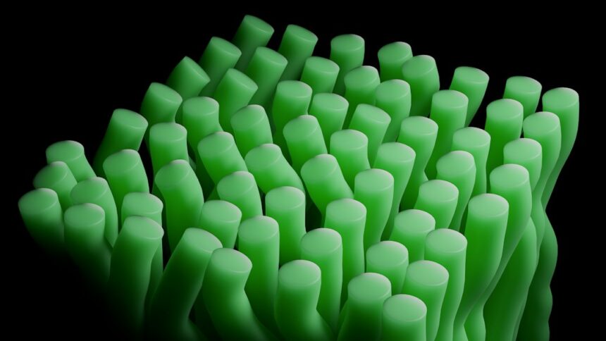 Rows of glowing green cylindrical forms against a dark background, suggesting cultivated algae